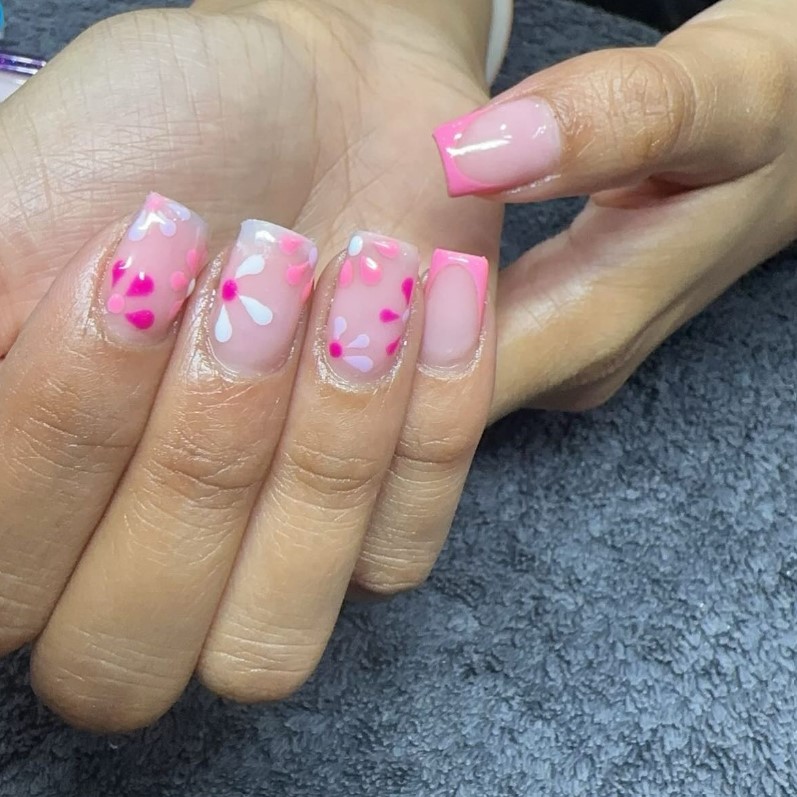 Pink French tips with hand-painted flowers